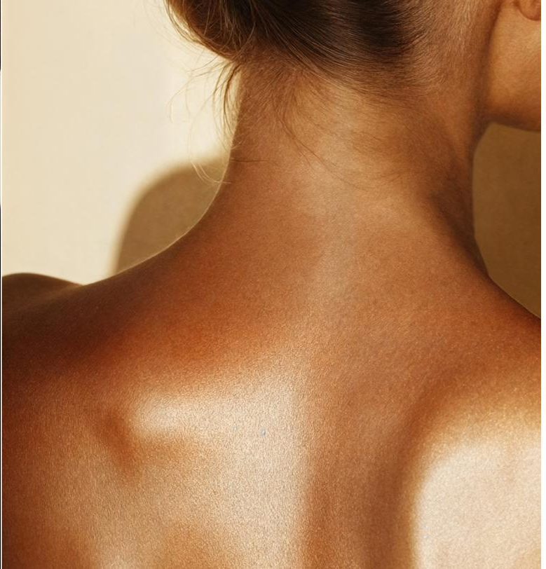 Close detail of healthy, hydrated skin in warm light
