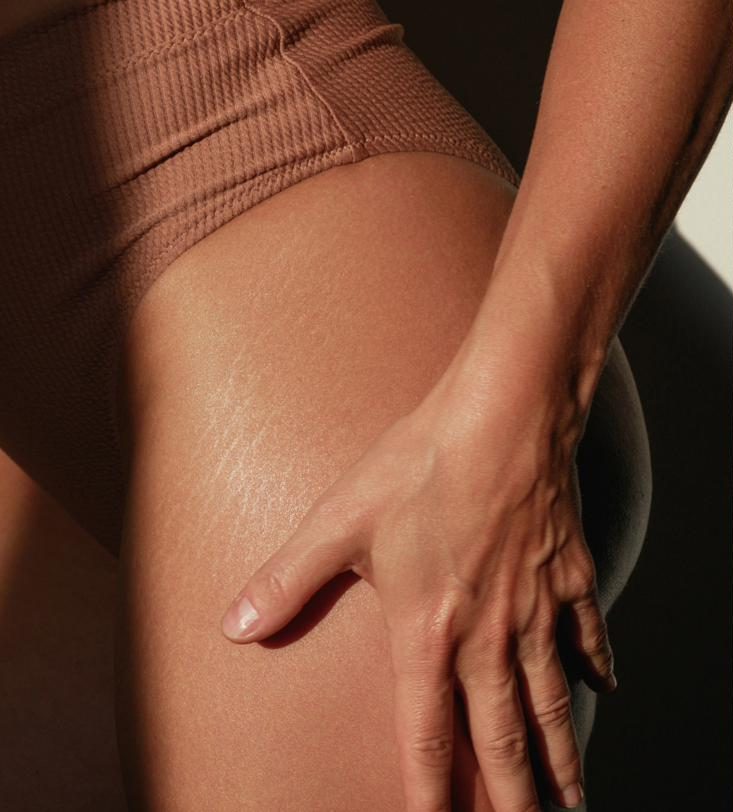 Smooth, oiled skin on the leg and hip