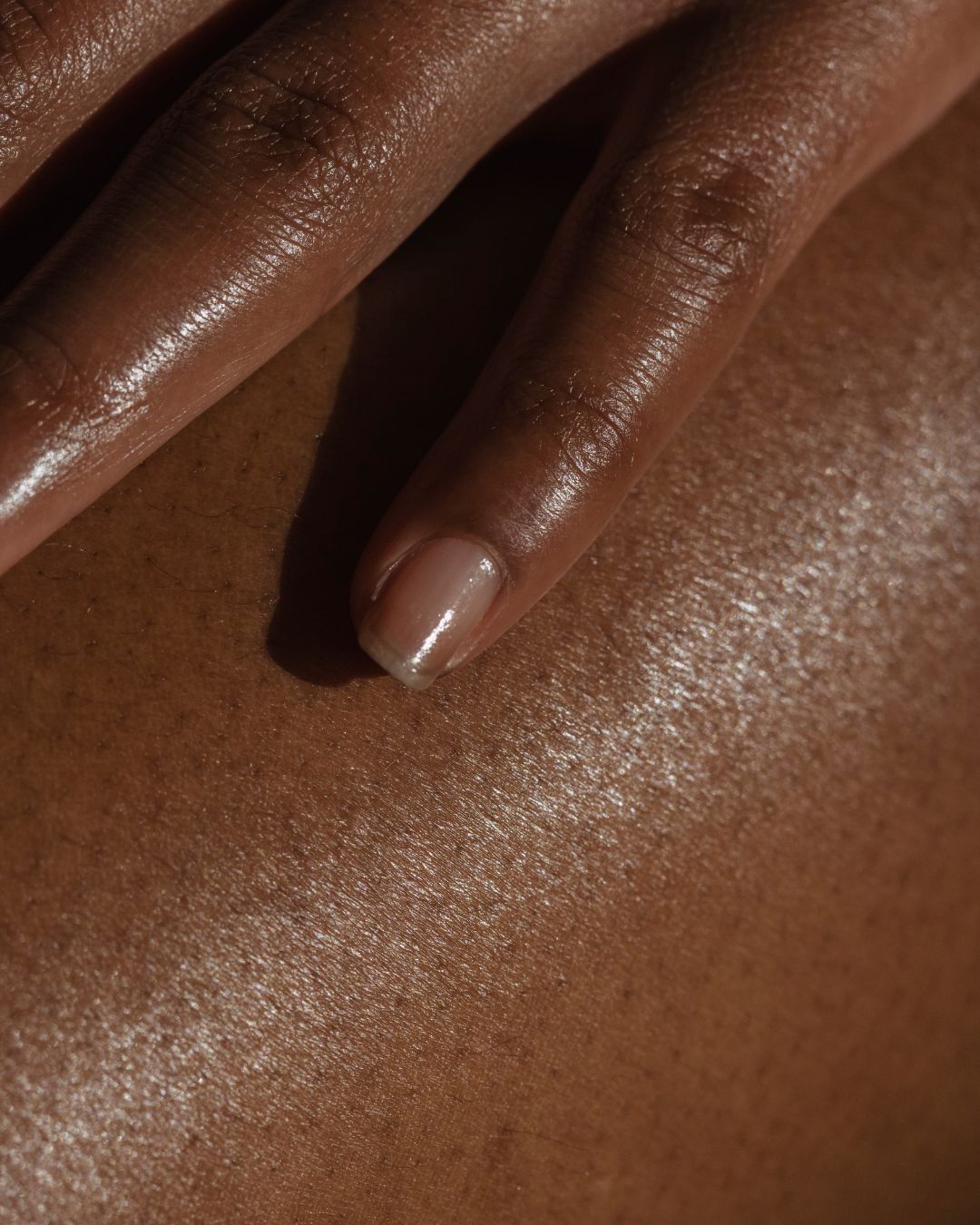 Sunlit skin across the shoulders and back